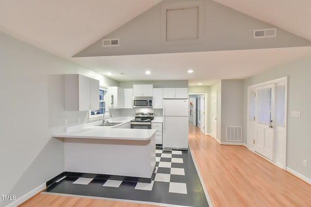 kitchen featuring visible vents, appliances with stainless steel finishes, light countertops, and a sink