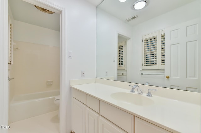 full bathroom featuring toilet, shower / tub combination, vanity, and visible vents