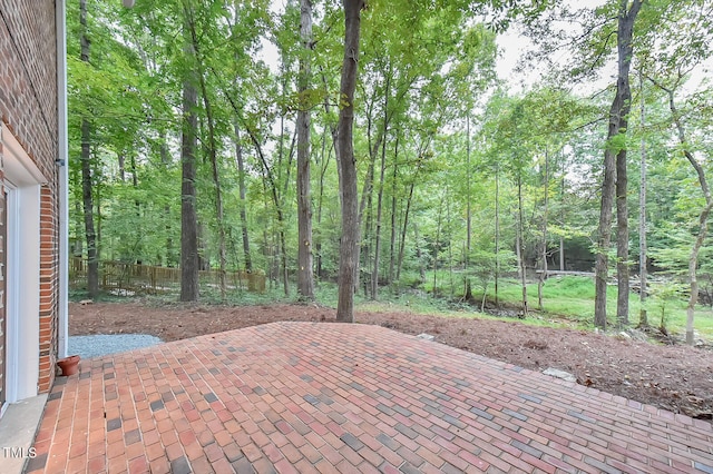 view of patio featuring fence