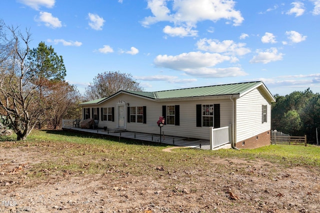 view of front facade with a patio area and a front yard