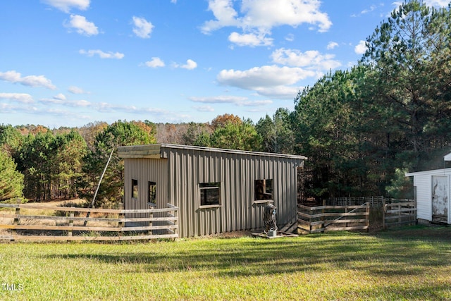 view of outdoor structure with a yard