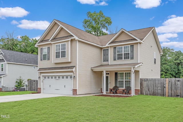 view of front of property with a garage and a front lawn