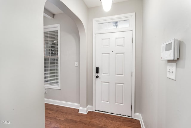 foyer with dark hardwood / wood-style flooring