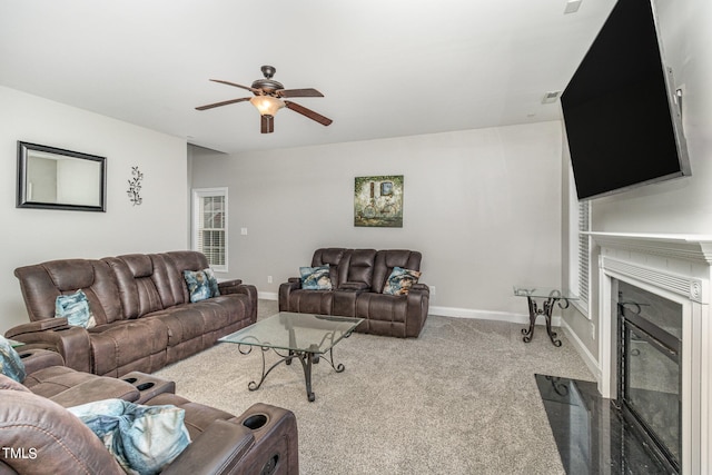 living room featuring ceiling fan and light carpet