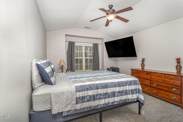 bedroom featuring ceiling fan, carpet flooring, and vaulted ceiling