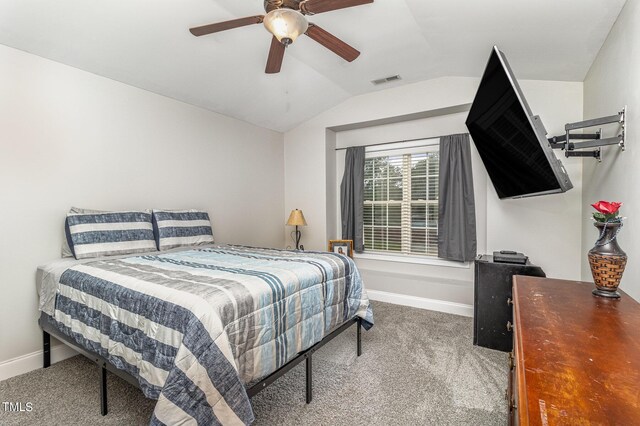 bedroom featuring ceiling fan, carpet floors, and vaulted ceiling