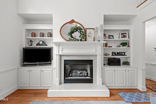 unfurnished living room with light hardwood / wood-style floors