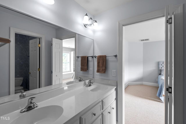 bathroom with vanity and toilet