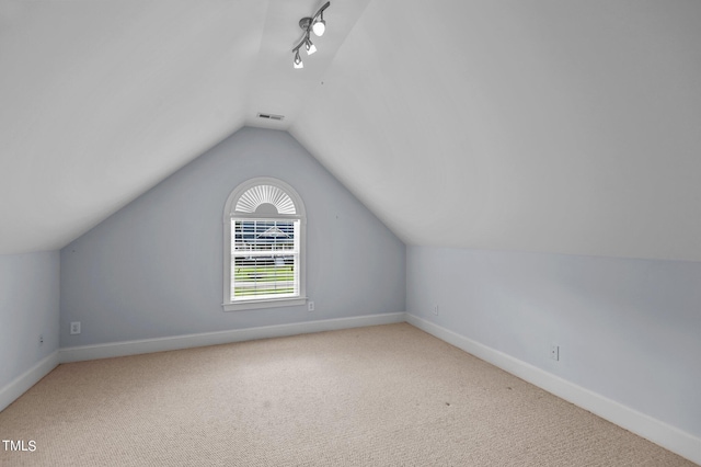 bonus room with carpet and lofted ceiling