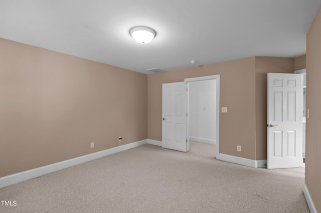 unfurnished bedroom with light carpet