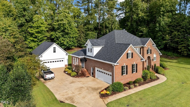 view of front facade with a garage and a front lawn