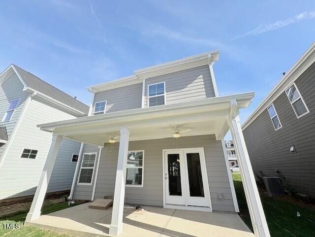 back of property with covered porch