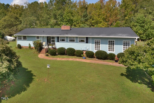 ranch-style home with a front yard