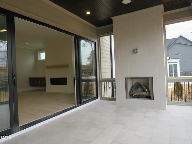 view of patio featuring a large fireplace