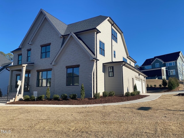 view of front of home featuring brick siding