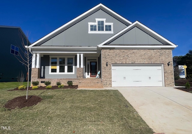 craftsman house with a front lawn and a garage