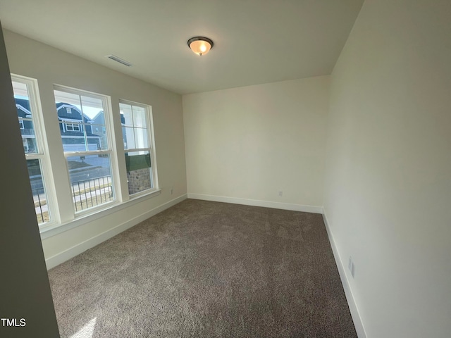 empty room featuring carpet flooring