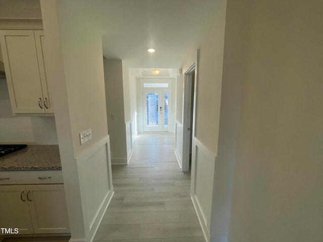 hallway featuring light hardwood / wood-style flooring