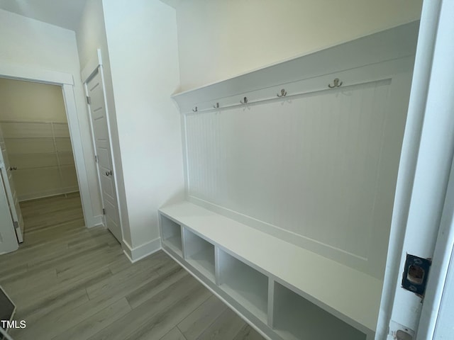 mudroom with light hardwood / wood-style floors