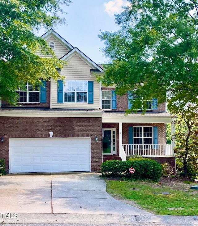 view of front of home with a garage and a porch