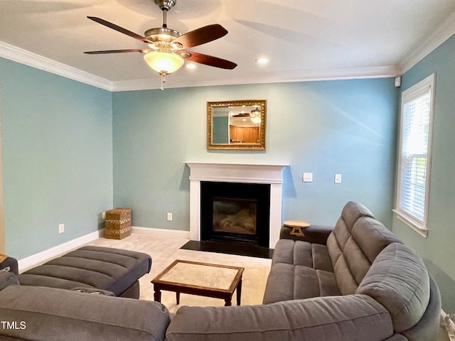 carpeted living room with crown molding and ceiling fan