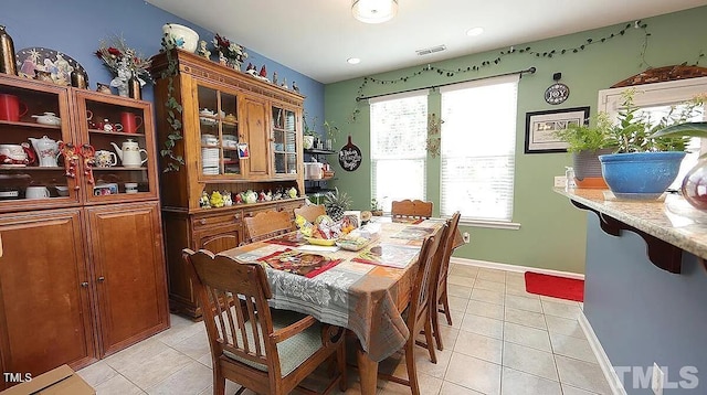 dining space with light tile patterned floors