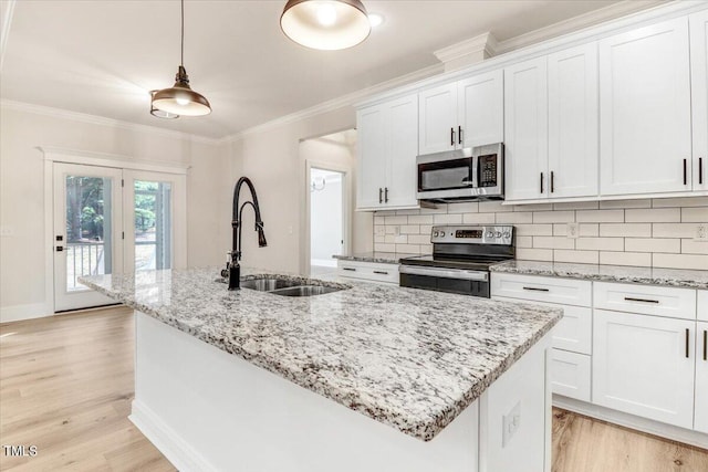 kitchen featuring light wood-type flooring, white cabinetry, sink, and stainless steel appliances