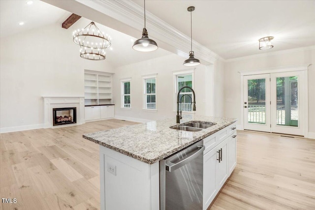 kitchen featuring light hardwood / wood-style floors, stainless steel dishwasher, white cabinetry, and sink