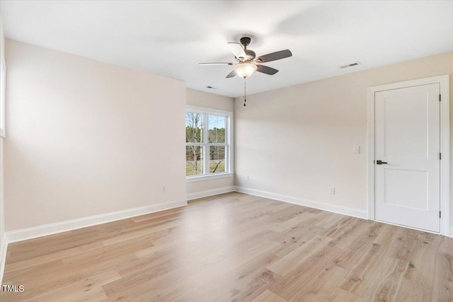 empty room featuring light wood-type flooring and ceiling fan