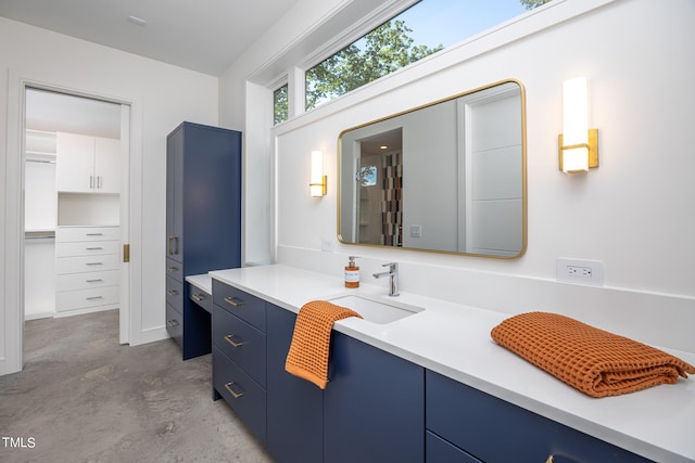 bathroom with concrete flooring and vanity