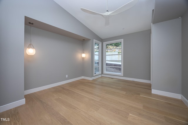 empty room featuring lofted ceiling and light hardwood / wood-style floors