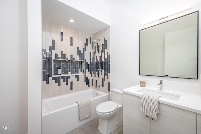 full bathroom featuring tiled shower / bath combo, vanity, and toilet