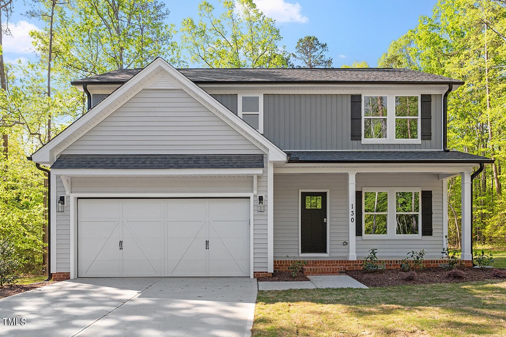 view of front of house with a front lawn and a garage