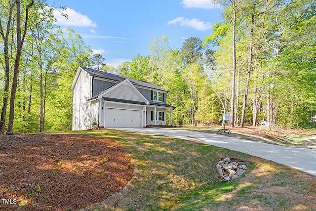 front facade featuring a front lawn and a garage