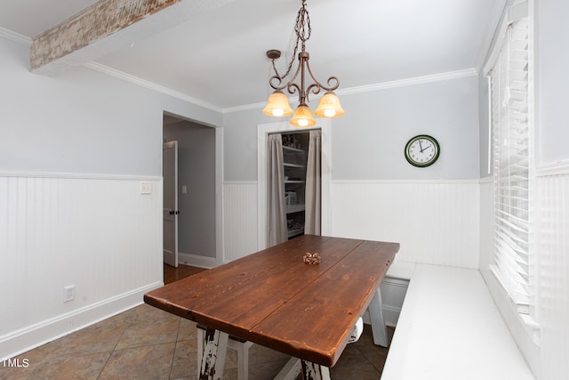 dining area featuring an inviting chandelier and ornamental molding