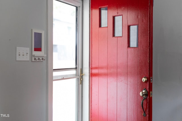 doorway featuring wooden walls