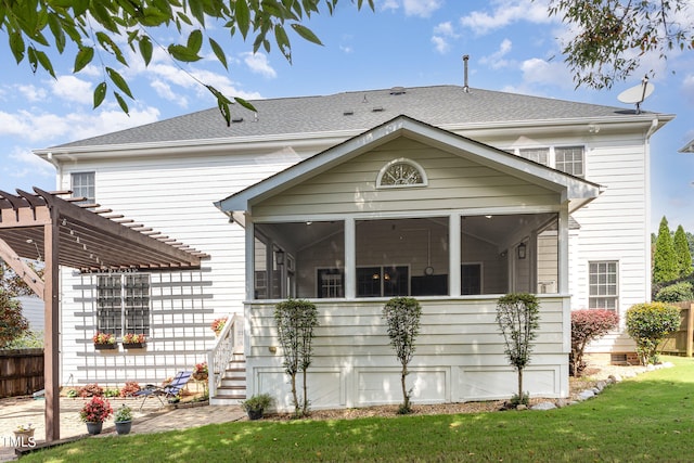 view of front of home featuring a sunroom, a pergola, and a front yard