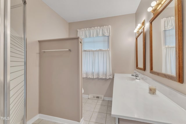 bathroom featuring vanity, toilet, and tile patterned floors