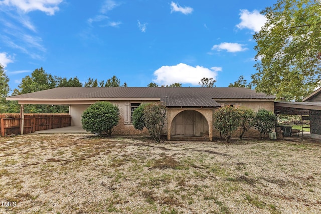 ranch-style house with a carport