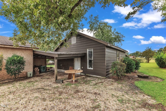 back of house with a yard