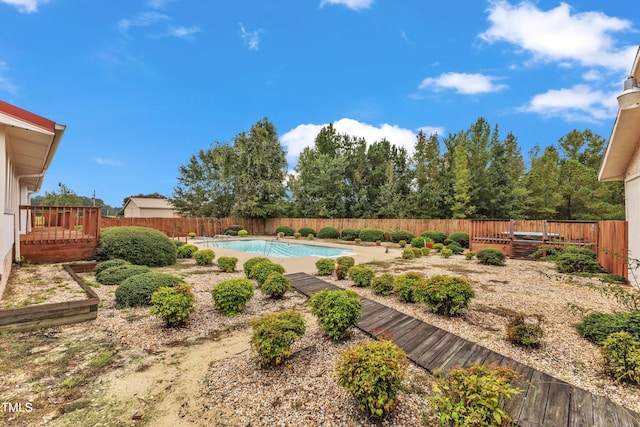 view of yard with a pool side deck