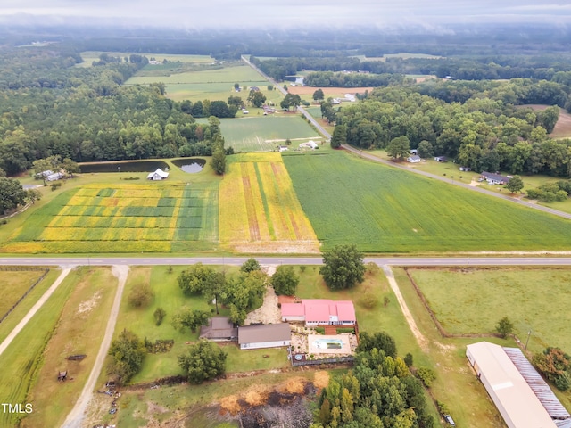 birds eye view of property with a rural view