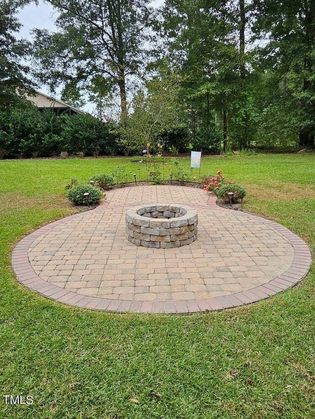 view of patio / terrace featuring an outdoor fire pit