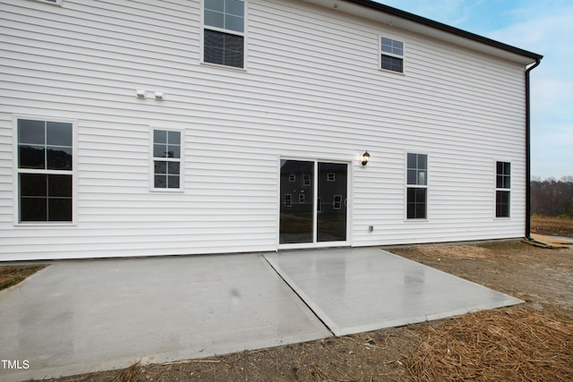 rear view of property featuring a patio area