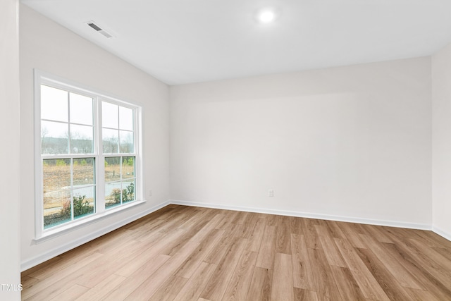 spare room with light hardwood / wood-style floors