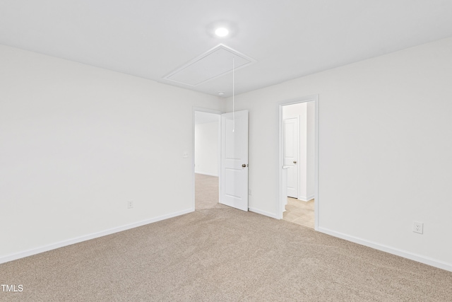 unfurnished room with light carpet