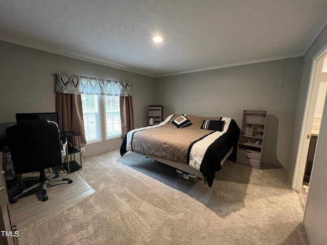 carpeted bedroom featuring a textured ceiling and ornamental molding