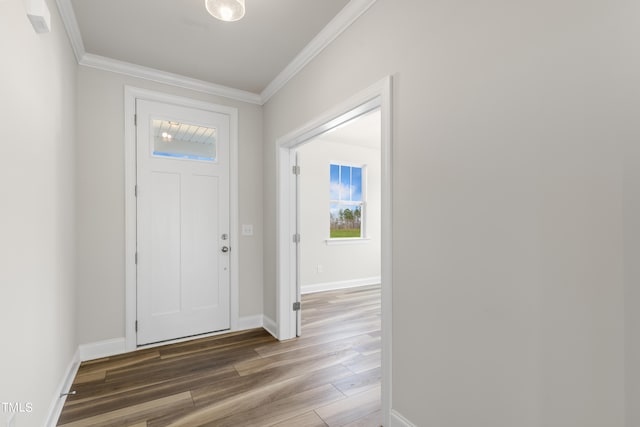 entryway with dark hardwood / wood-style flooring and ornamental molding