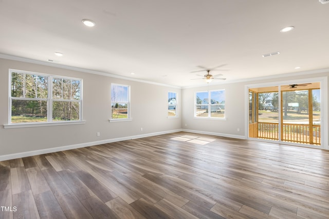 empty room with ceiling fan, wood-type flooring, and crown molding