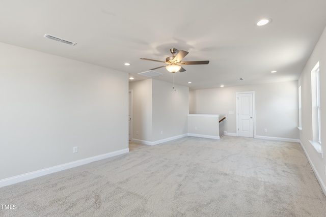 carpeted empty room featuring ceiling fan